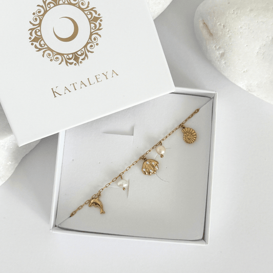 Dainty gold ocean charms bracelet with pearls by Kataleya Jewellery