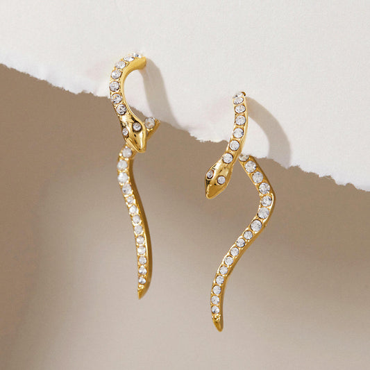 Ophira Serpent Earrings featuring polished gold snake design with pavé set crystals, 3.45cm length, lightweight stylish jewelry.