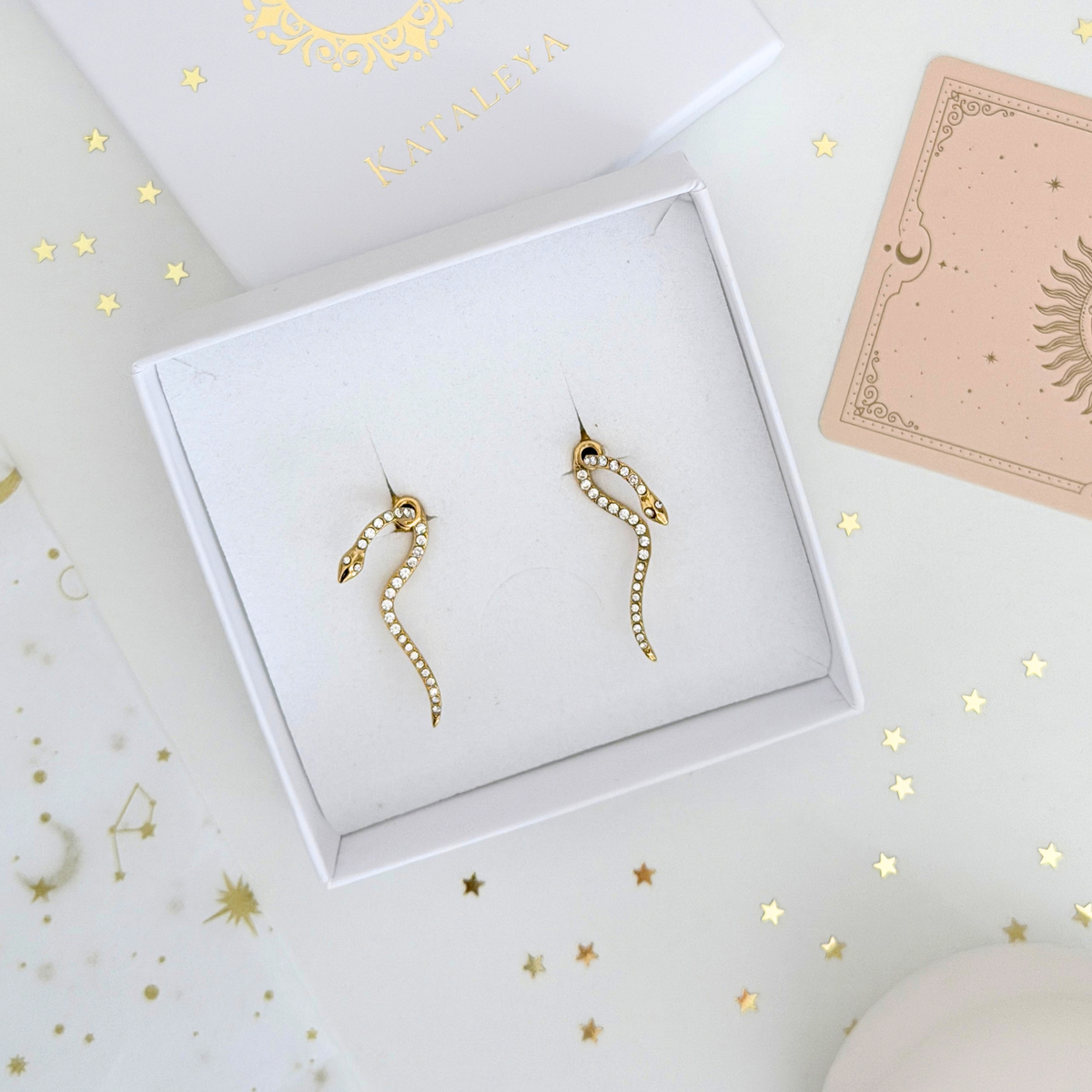 Ophira Serpent Earrings in a gift box, featuring a serpent design with pavé crystals, ideal for dramatic fashion.