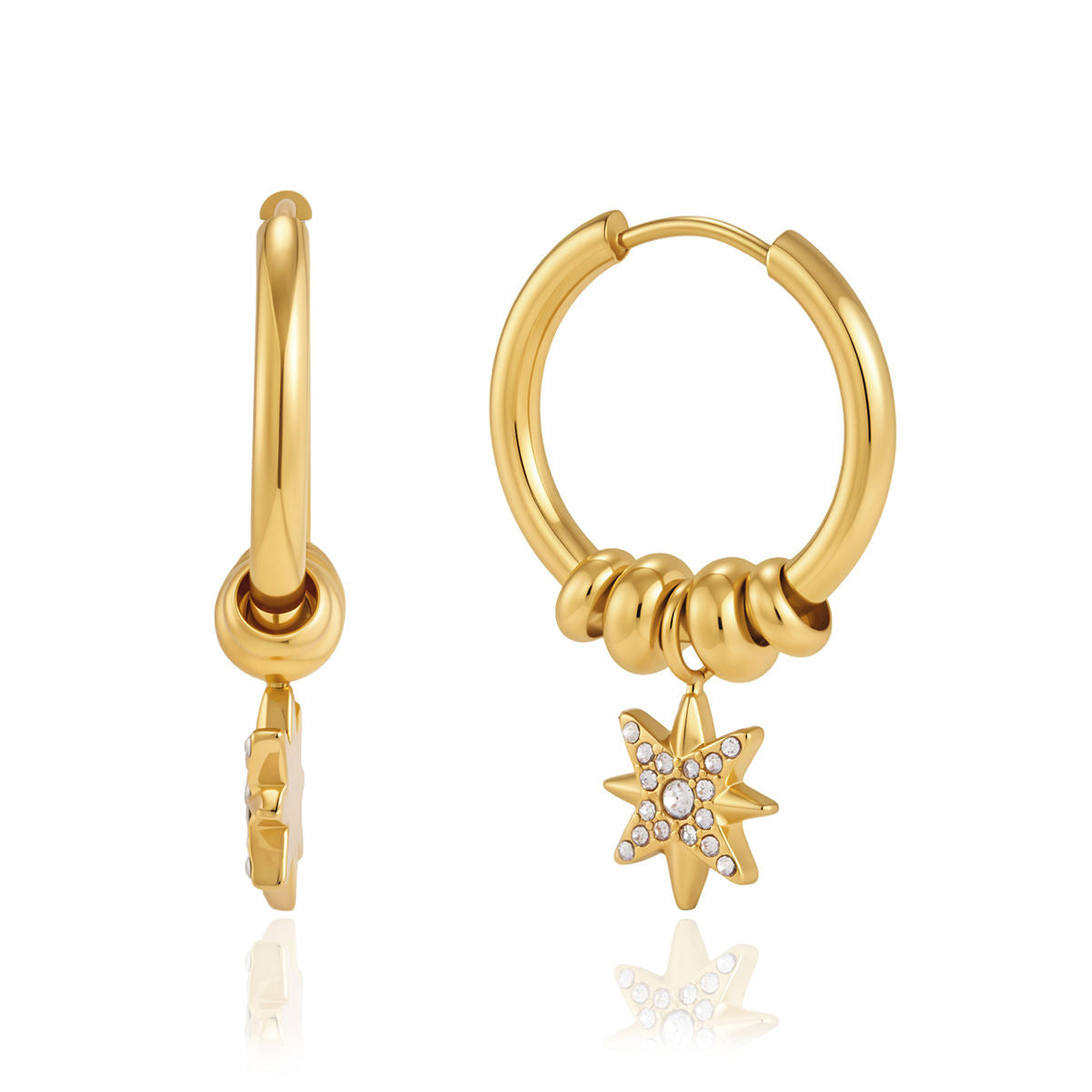 Small gold huggies earrings from Polaris Star Hoops with four gold beads and pavé star charm.