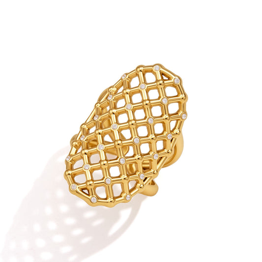 Vela Lattice Ring featuring fine gold bars and cubic zirconia stones in an architectural design.