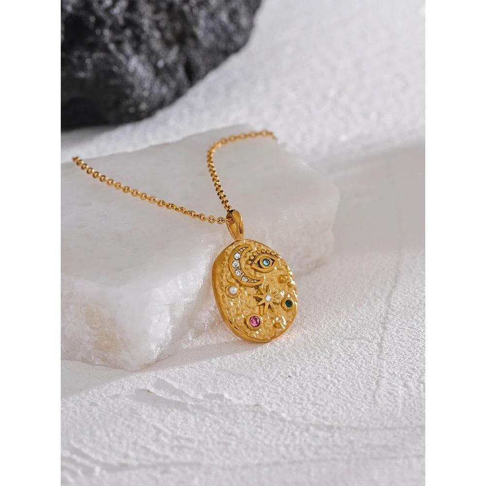 AlUla Gold Hammered Pendant, embellished with motifs of the moon, eye, star, and colorful stones - Necklace by Kataleya.