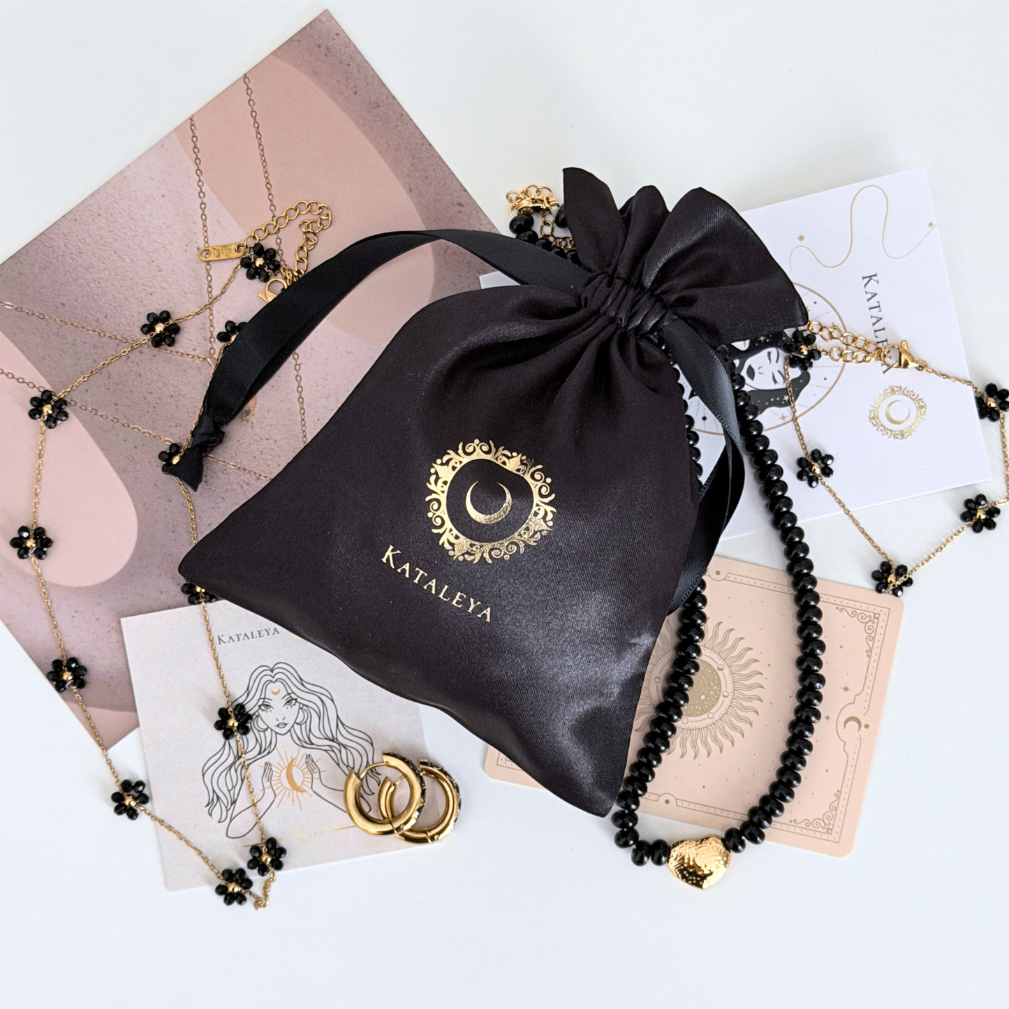 Black Kataleya mystery bag - four waterproof gold-plated pieces including black beaded jewellery