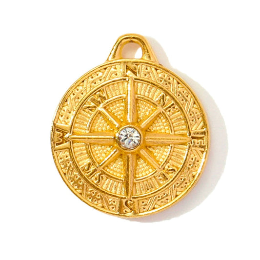 Gold Zircon Compass Charm on a white back ground - Kataleya Jewellery