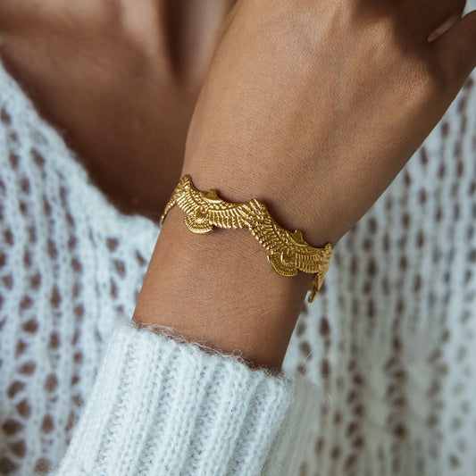 Spirit Eagle Cuff Bracelet on a woman's wrist, 18ct gold plated, waterproof, tarnish free cuff bracelet.