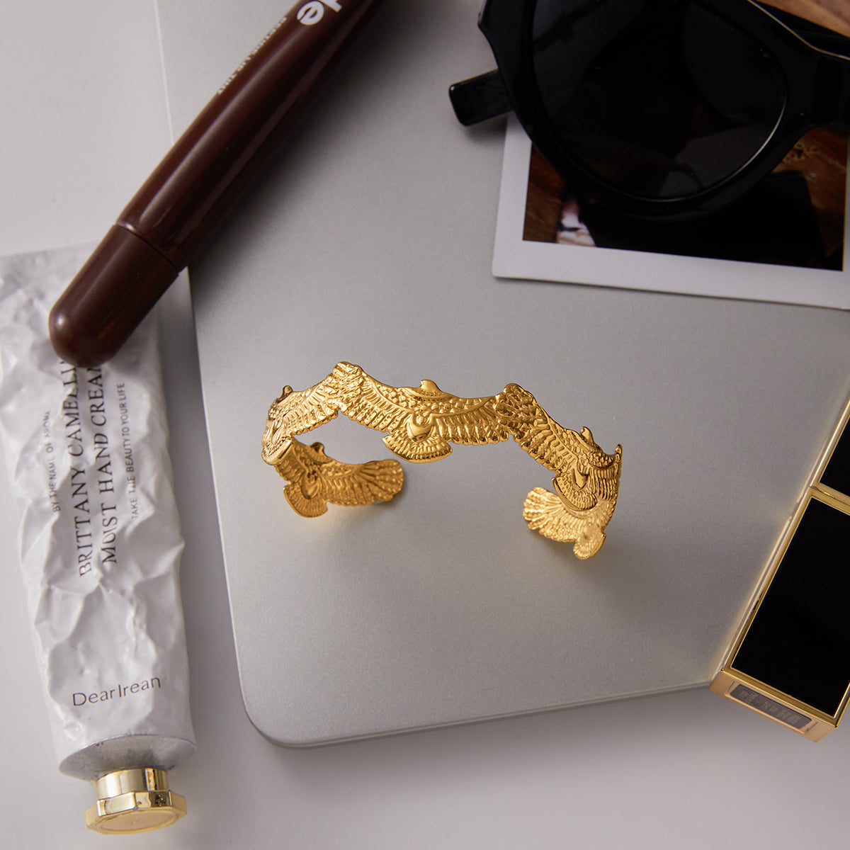 Spirit Eagle Cuff Bracelet | Waterproof & Tarnish Free with intricate eagle design on a table.