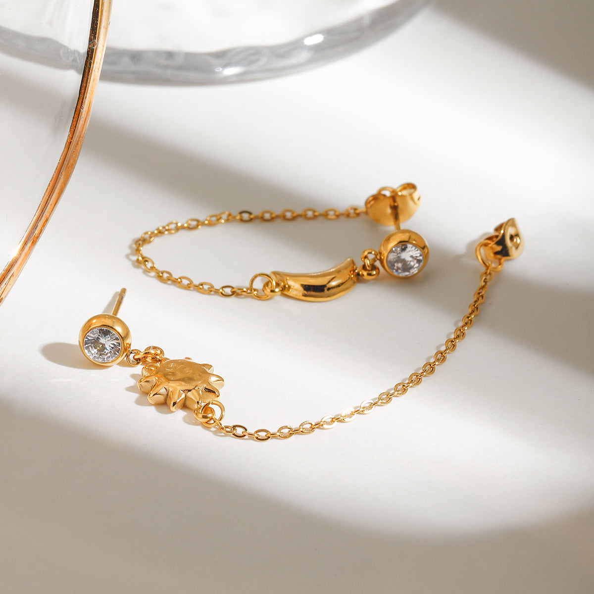 Celestial Harmony Earrings with zircon studs and golden sun and crescent moon design, elegant and waterproof.