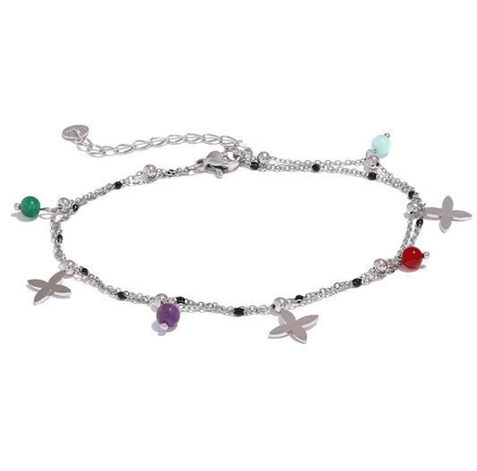 The Huacachina Anklet, embellished with colorful beads and silver flowers, is available in silver from Kataleya.