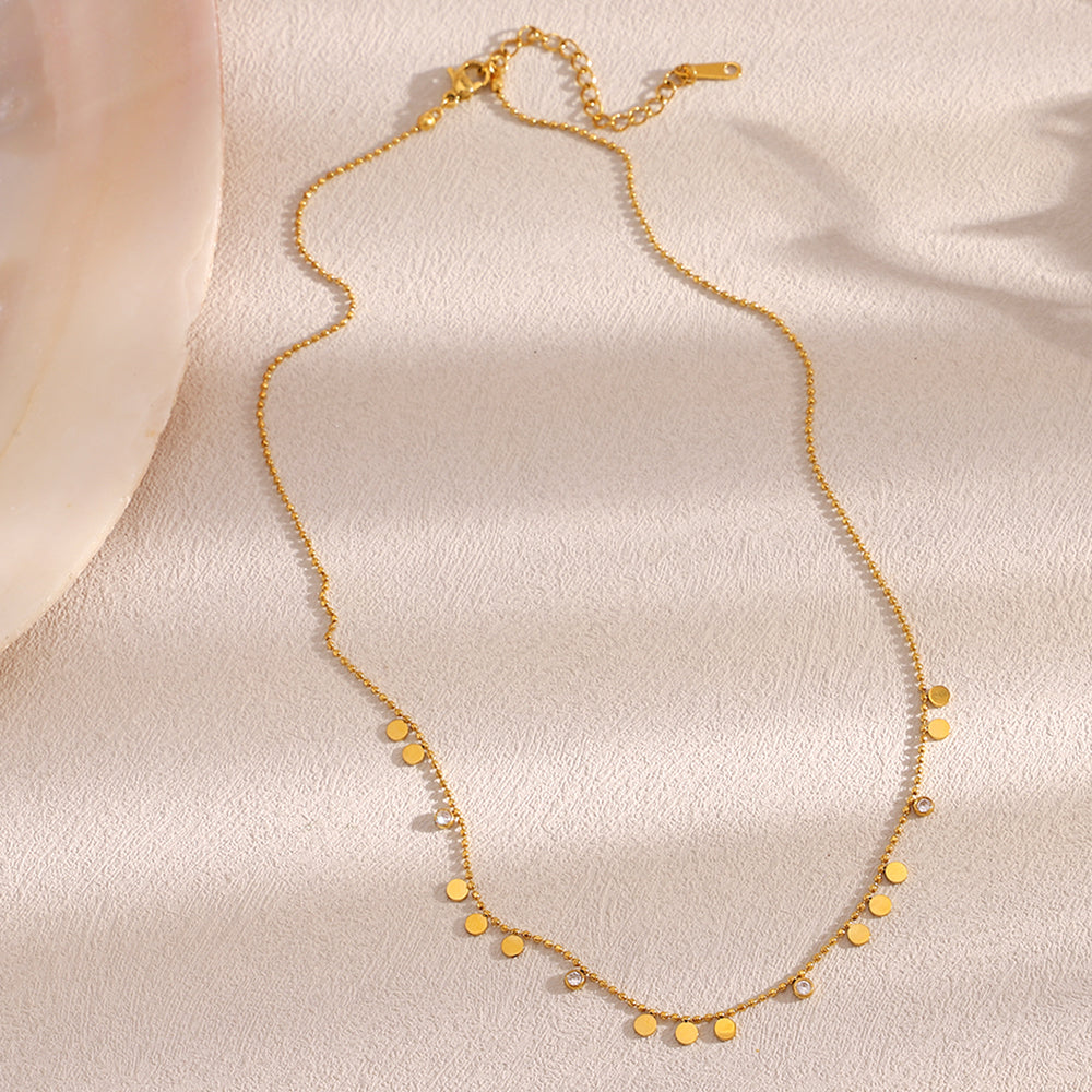 Disc Charm Necklace featuring tiny polished discs for a dainty and elegant look.
