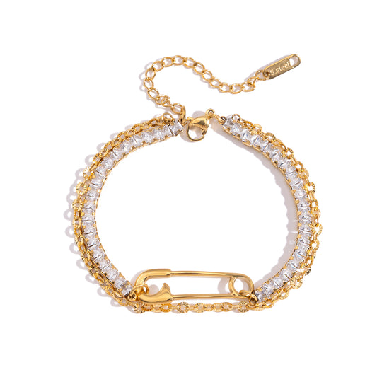 Safety Pin Tennis Bracelet with sparkling crystals and a trendy safety pin accent on a white background.